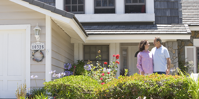 A couple considers the benefits of refinancing their home mortgage.